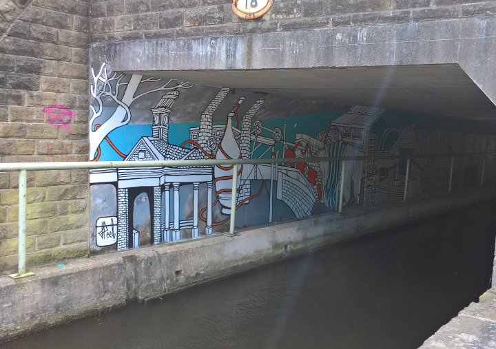 Streets of Colour - wall painting on canal path in Huddersfield