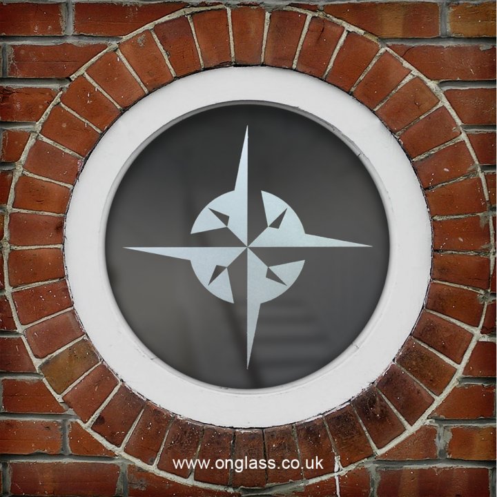 Compass rose round window